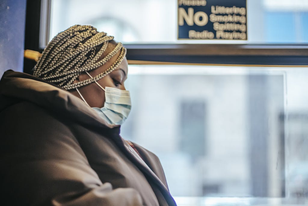 Black woman in epidemic riding in bus